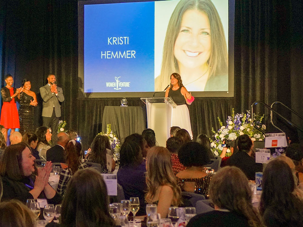 Kristi Hemmer speaking at an event